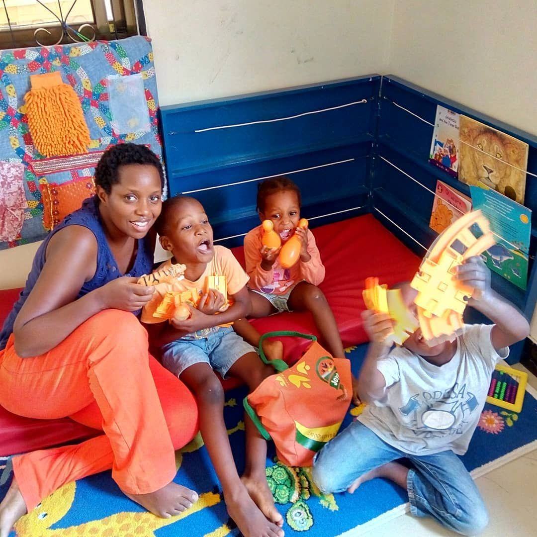 A Golden Rays teacher reading with young learners